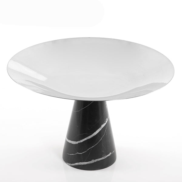 Black marble stand with a large silver metal plate