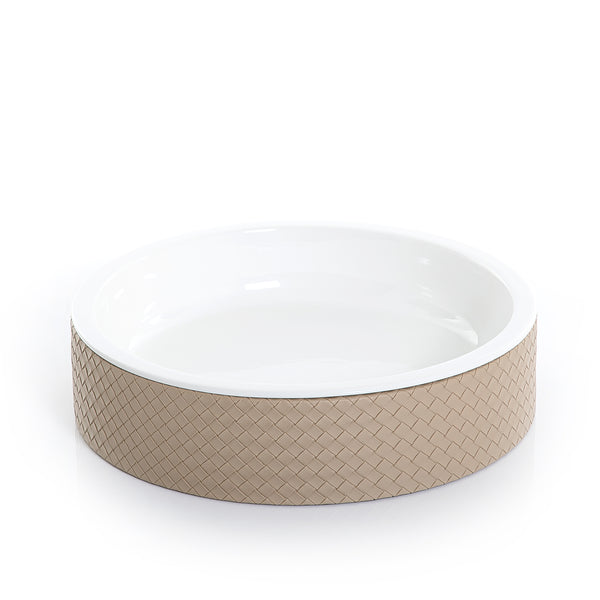 round ceramic plate with light brown leather base